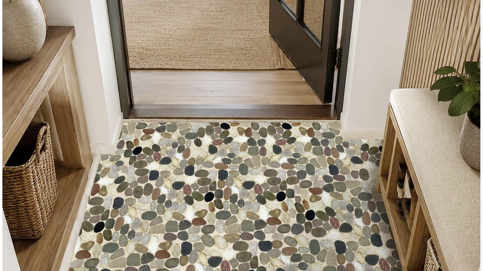 Mixed natural pebble mosaic installed in a residential entryway